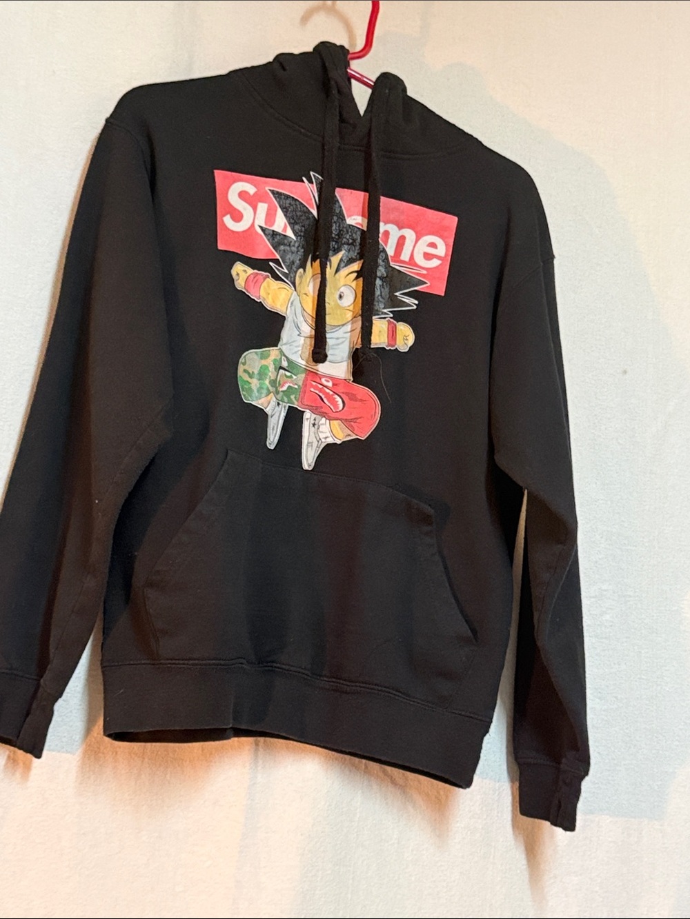 Supreme Black Hoodie with Red Box Logo and Multicolor Character